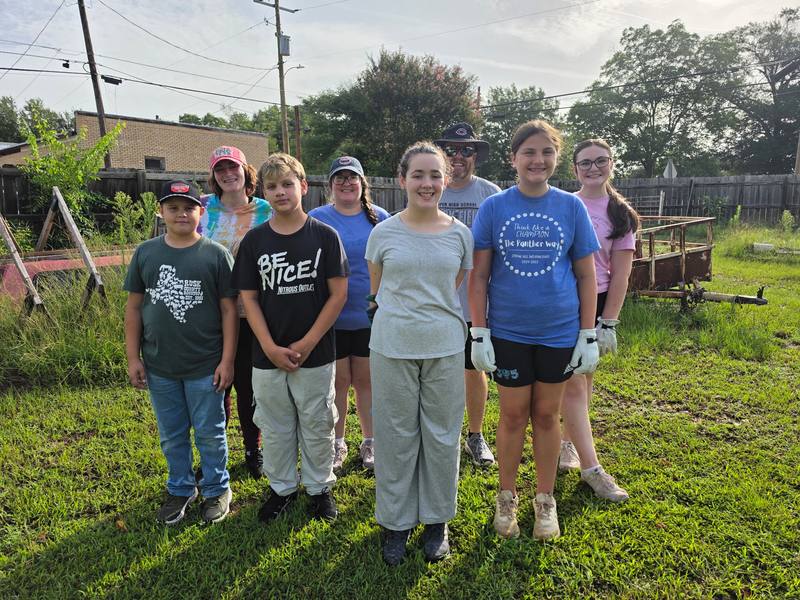 Kilgore Fuller Center volunteer group at a cleanup site