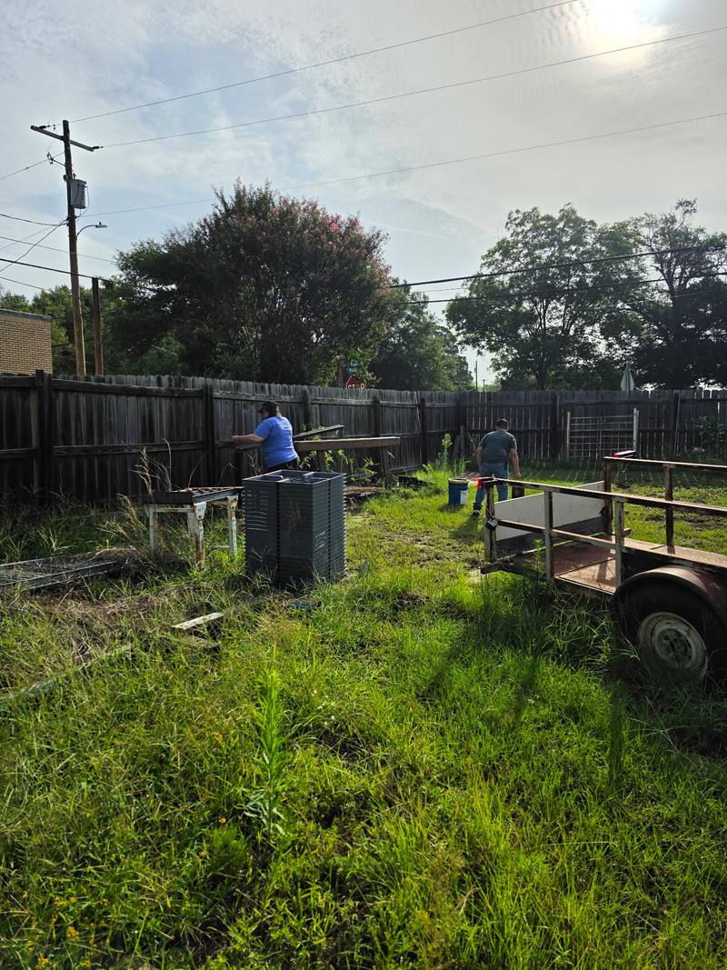 Volunteer working near a trailer