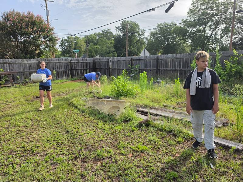 Volunteers standing across the cleanup site