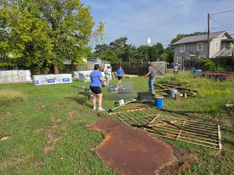 Volunteers spread across a cleanup site