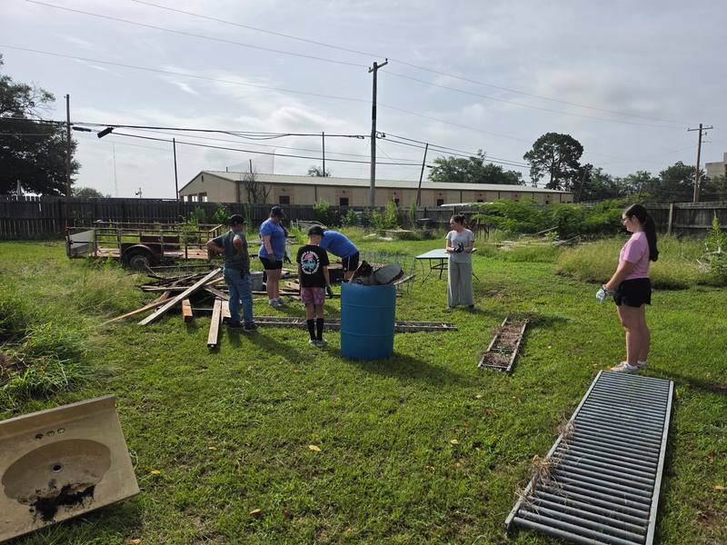 Volunteers working around a cleanup site