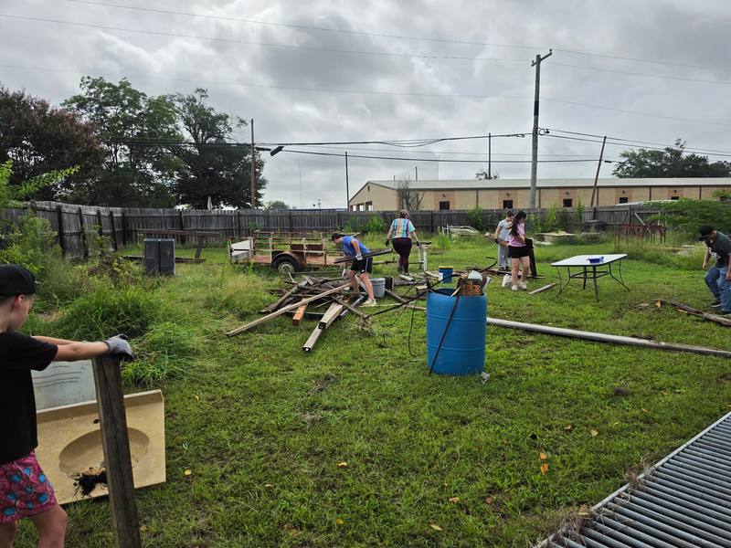 Volunteers gathered across the cleanup site